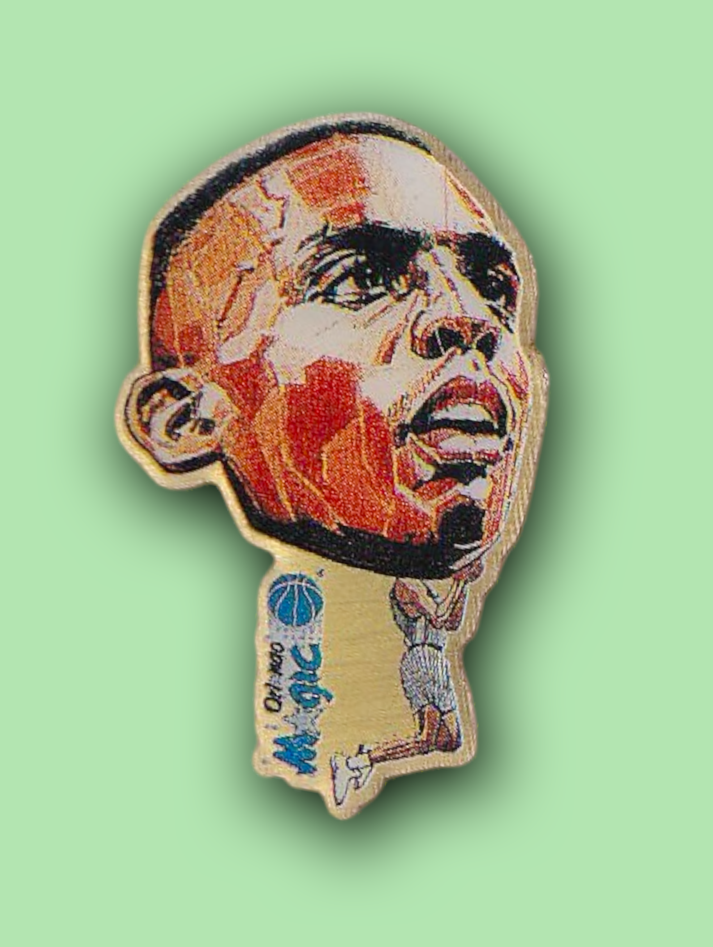 An enamel pin featuring a portrait of a famous Anfernee Hardaway
