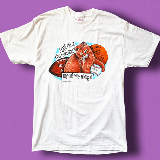 White crew neck t-shirt with a graphic print of a cat and the text 'Get rid of the husband my cat was allergic'