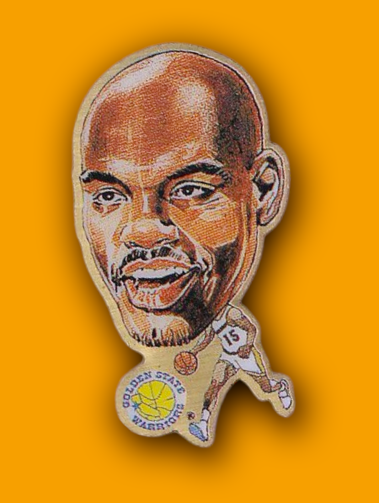 An enamel pin featuring a portrait of Lartell Sprewell