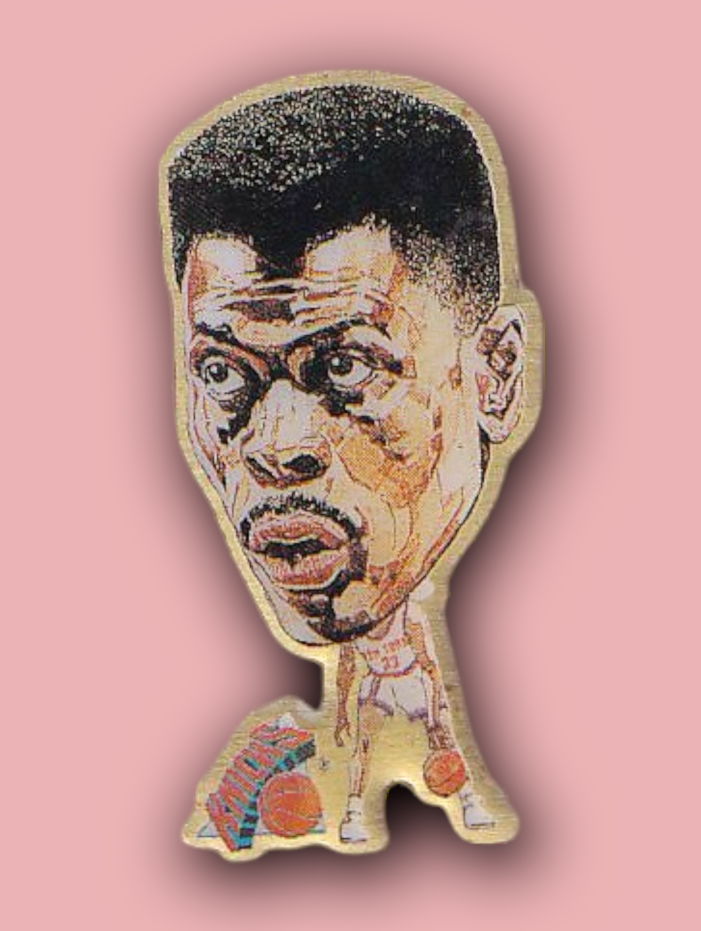 An enamel pin featuring a portrait of Patrick Ewing