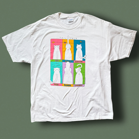 A white crew neck t-shirt with a graphic print of a cat in different poses on a multicolored background. Hep Cat Vintage Tee.