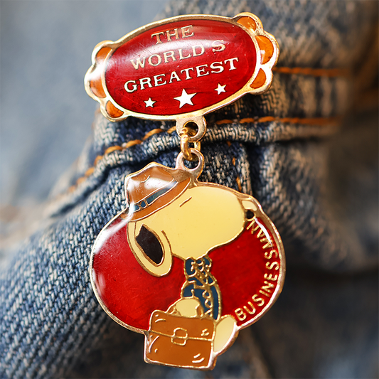 Pin with cartoon character on denim fabric