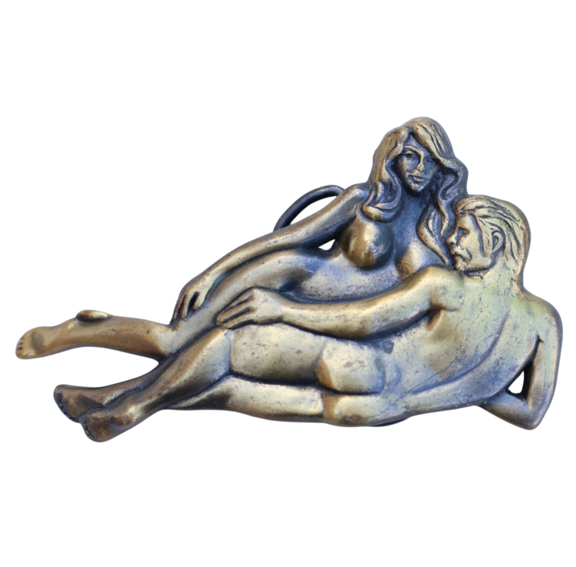 vintage belt buckle with laying nude couple