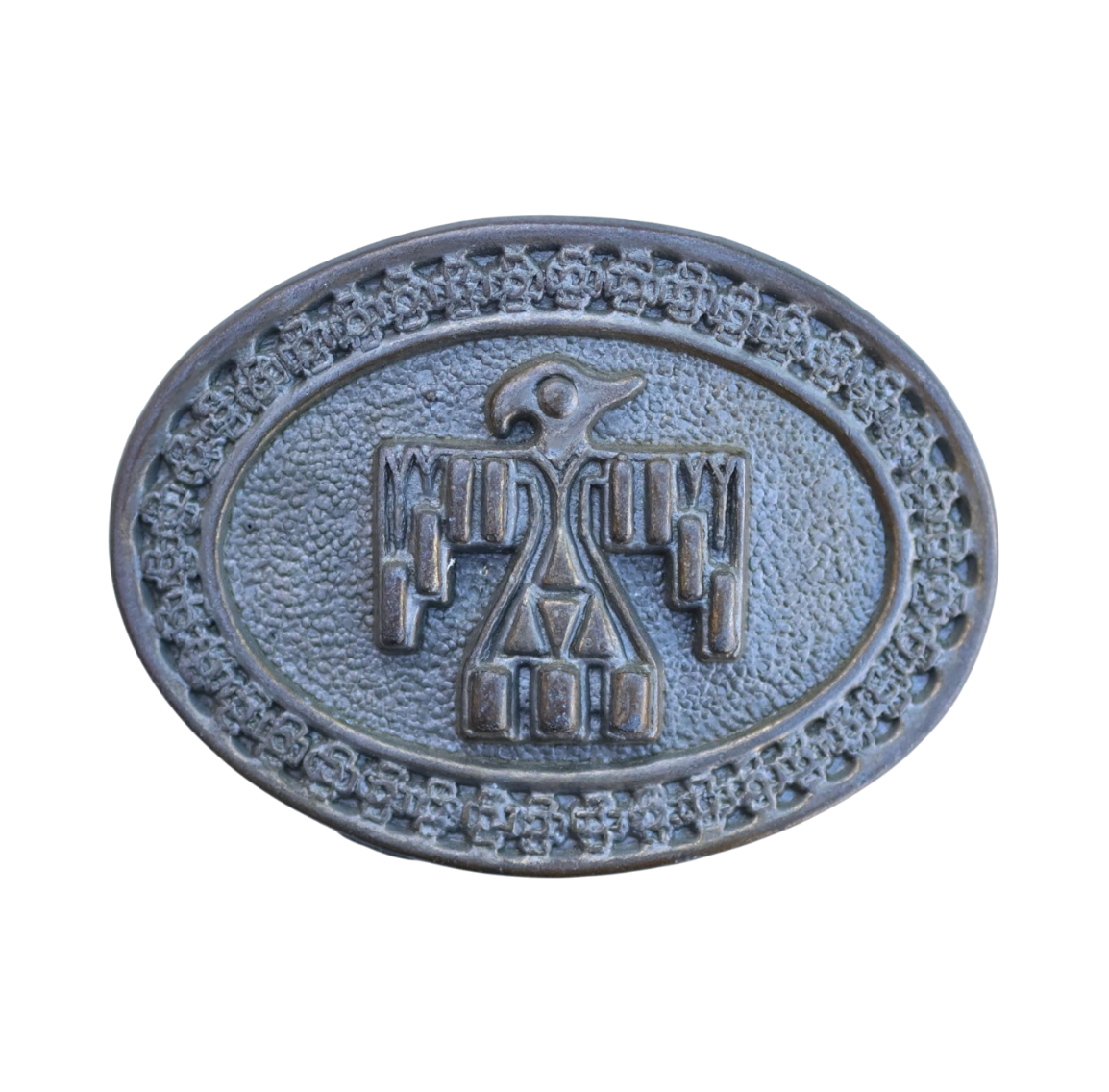 vintage belt buckle featuring a native american thunderbird symbol