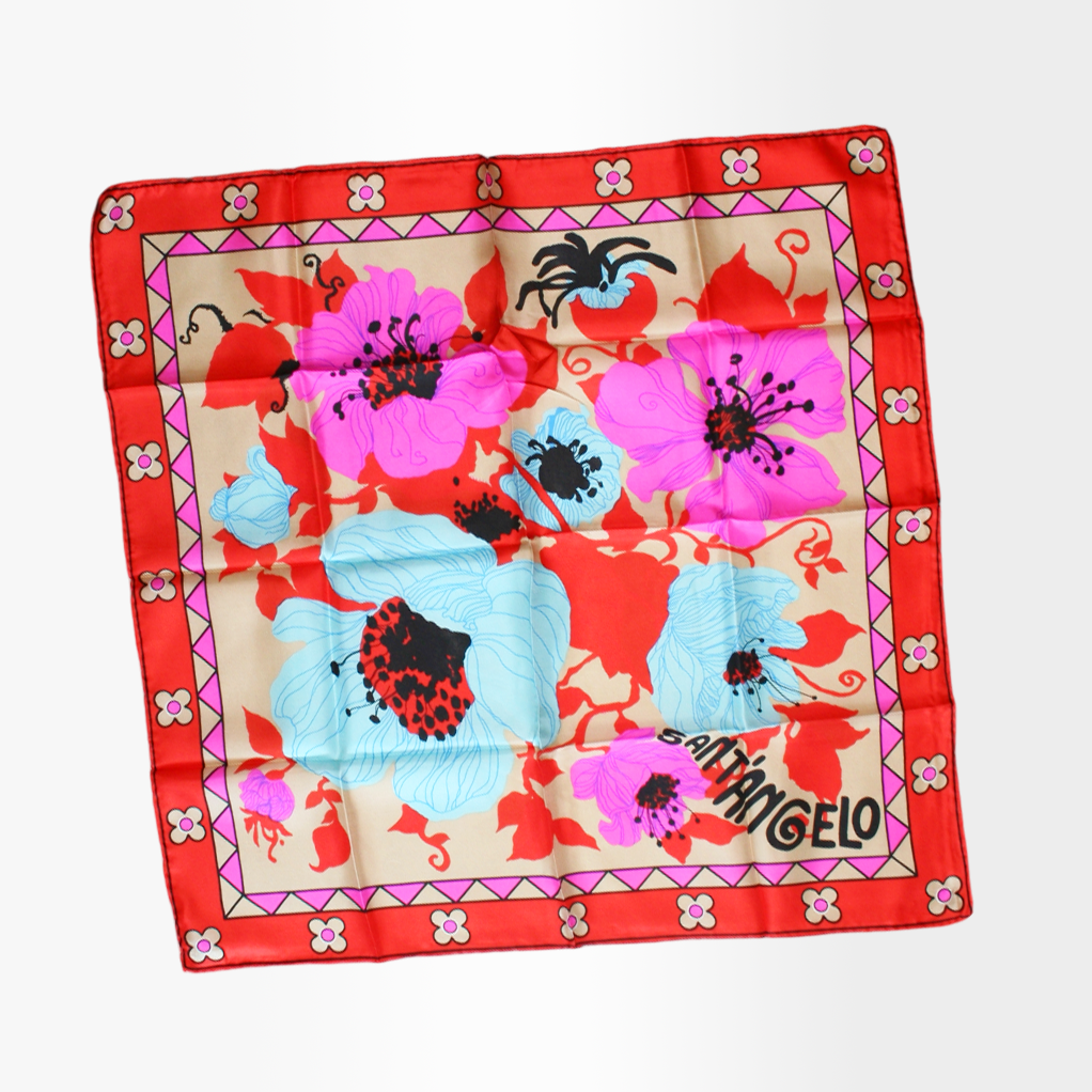 A silk scarf with a bold floral 'Poppy' print by Giorgio Sant'Angelo, featuring red, pink, blue, and yellow colors with a red border.