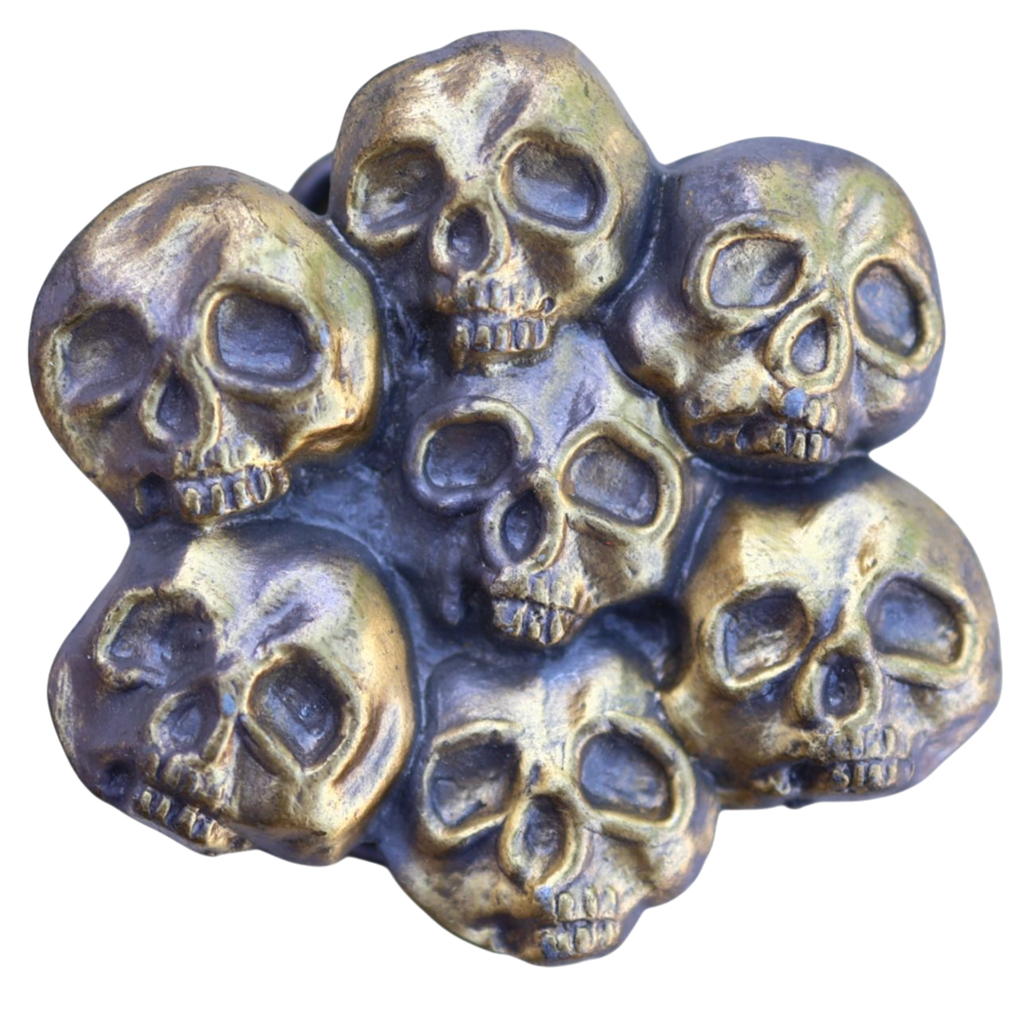 vintage belt buckle with multiple skull designs on a white background