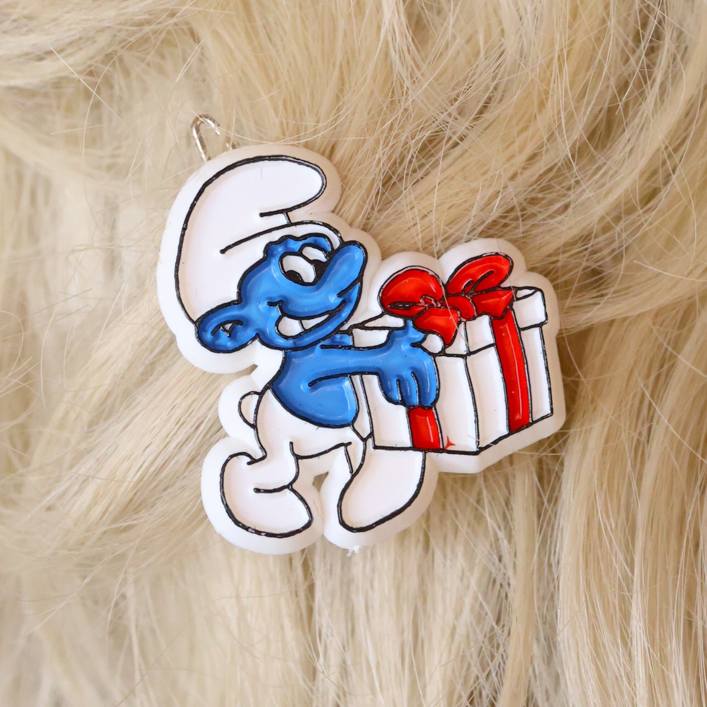 Vintage Peyo Smurf holding gift embossed and painted plastic hair beret