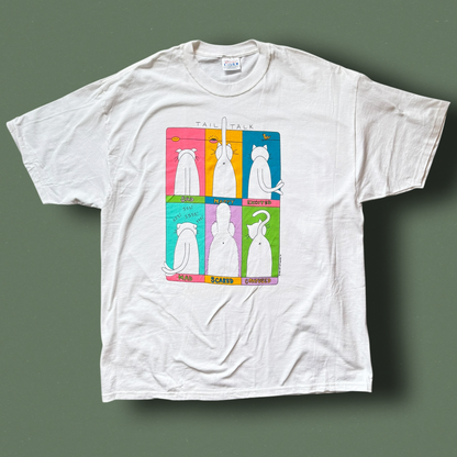 A white crew neck t-shirt with a graphic print of a cat in different poses on a multicolored background. Hep Cat Vintage Tee.