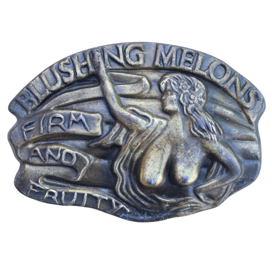 Metallic belt buckle with 'Blushing Melons' text and nude woman