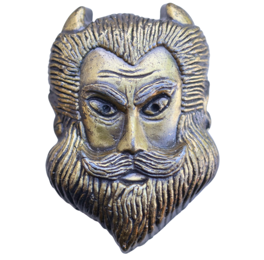 Bronze belt buckle of a bearded devil with horns 