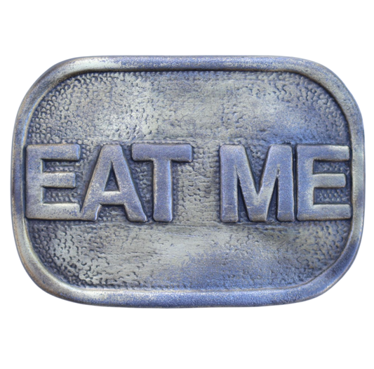 Metallic belt buckle with 'EAT ME' text