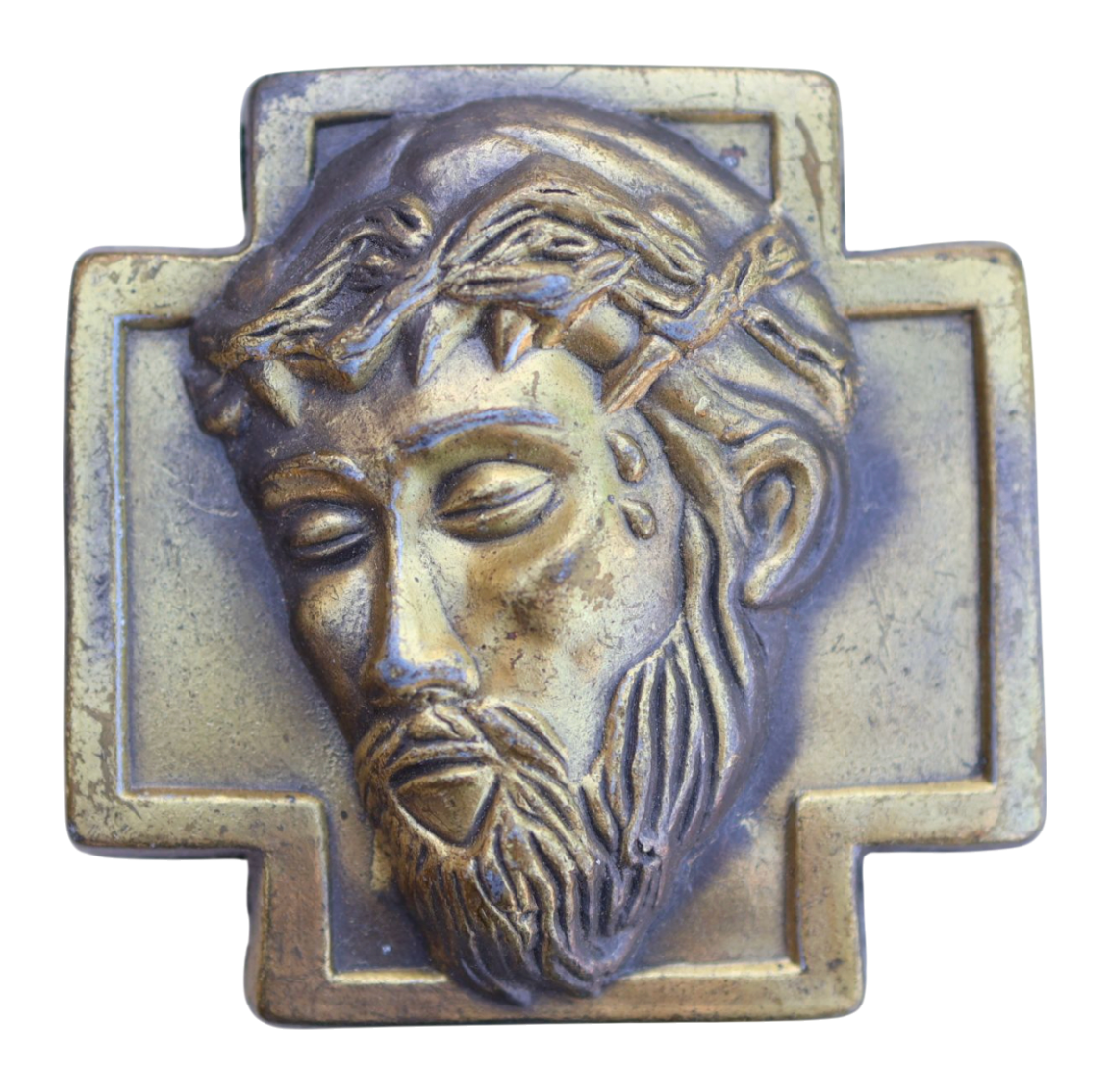 Bronze plaque of a jesus christ on a belt buckle