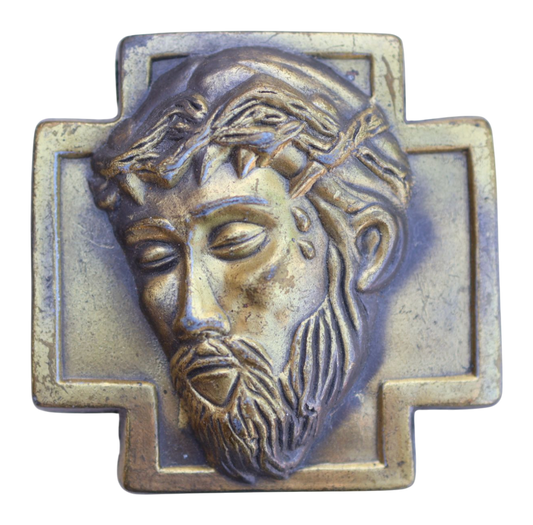 Bronze plaque of a jesus christ on a belt buckle