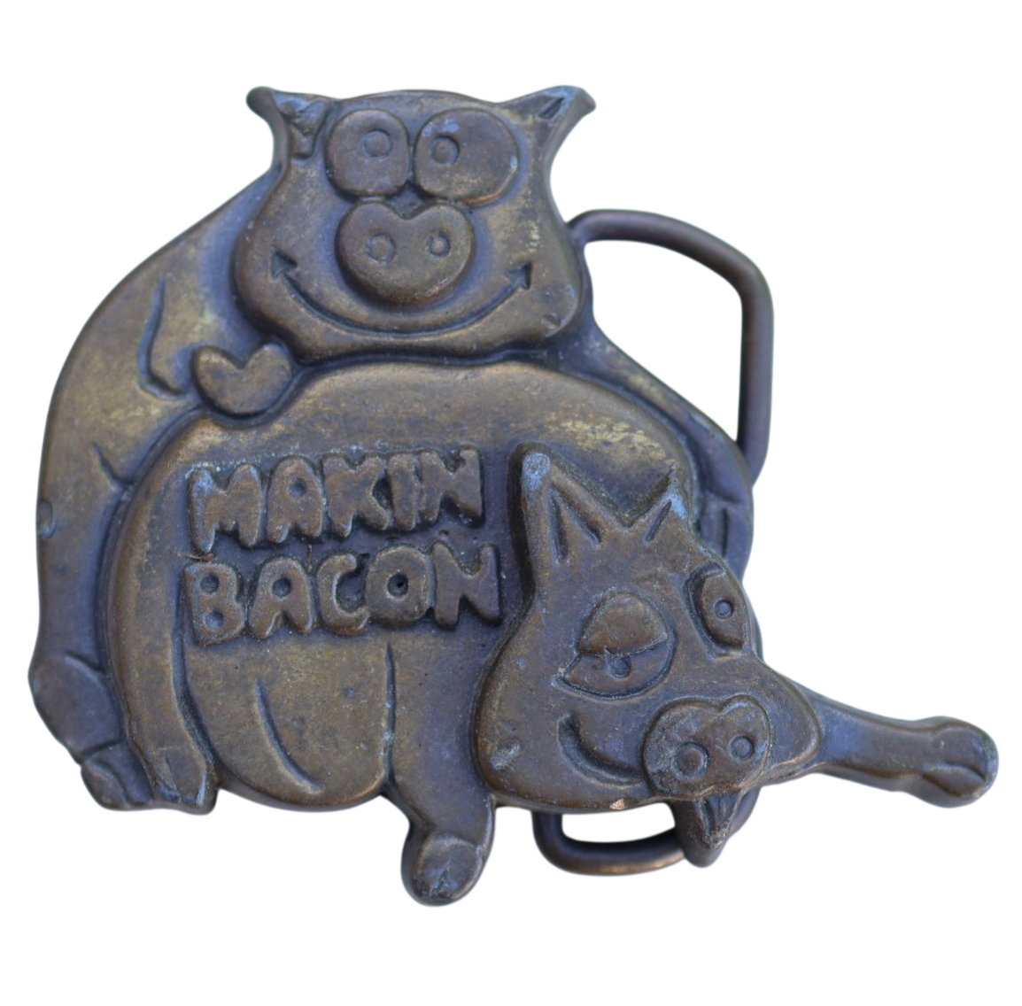 vintage belt buckle featuring two pigs in a suggestive position