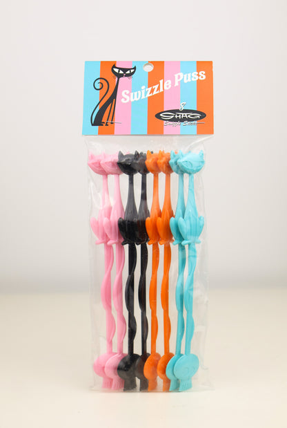 Set of colorful Shag, Josh Agle Cat swizzle sticks with a branded packaging on a light background