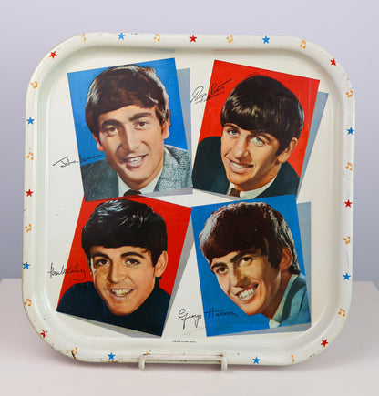 vintage 1964 Tray with images and signatures of The Beatles on a white background