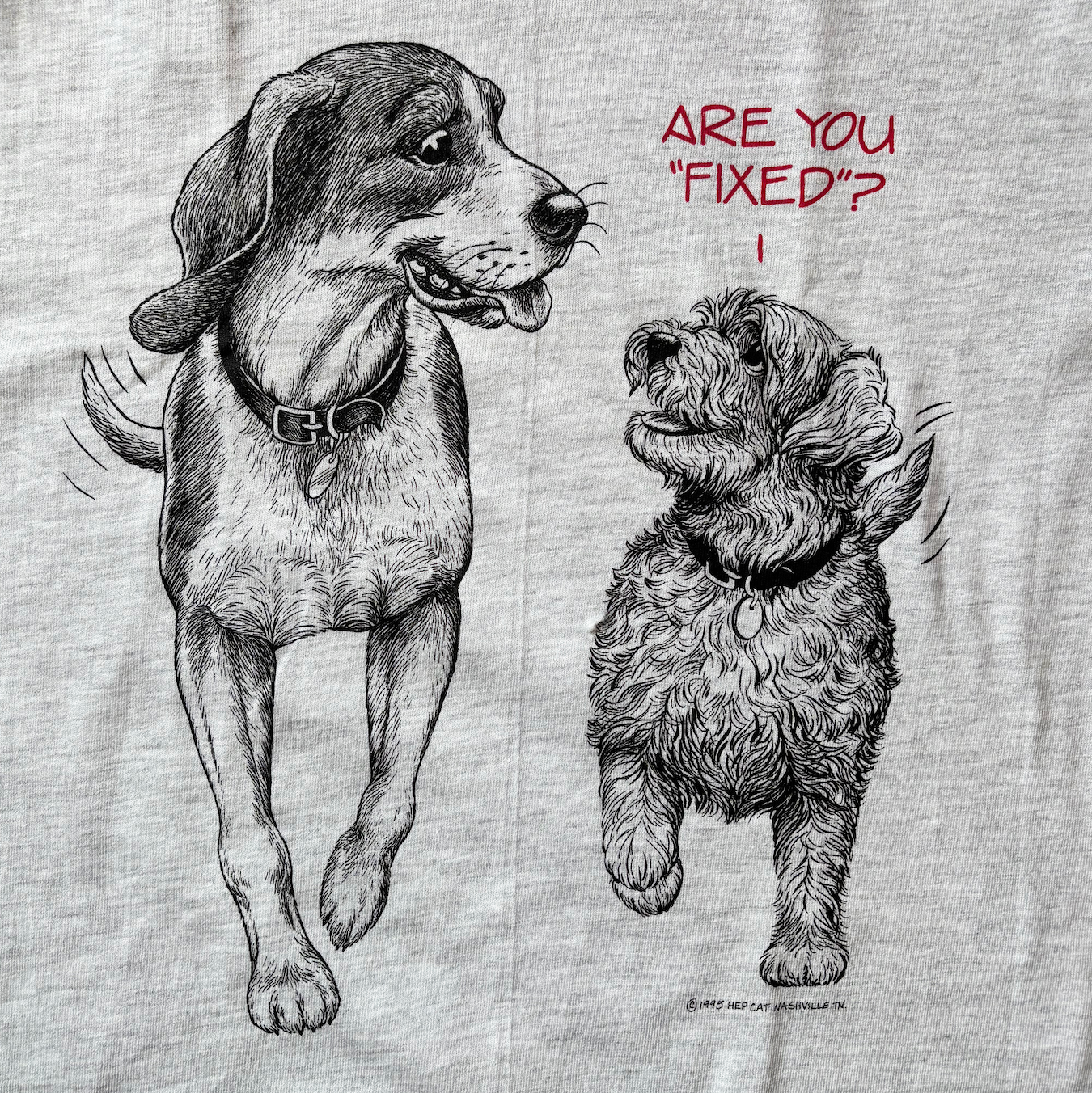 Vintage t shirt graphic featuring two dogs. One saying Are you fixed?