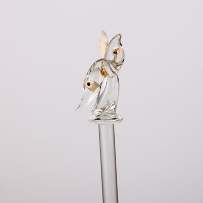Glass swizzle stick of a doe deer on a white background