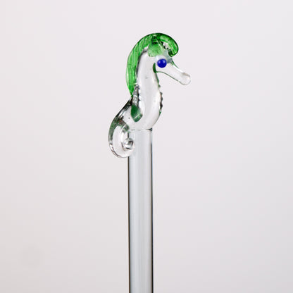 Glass seahorse stirrer on a white background