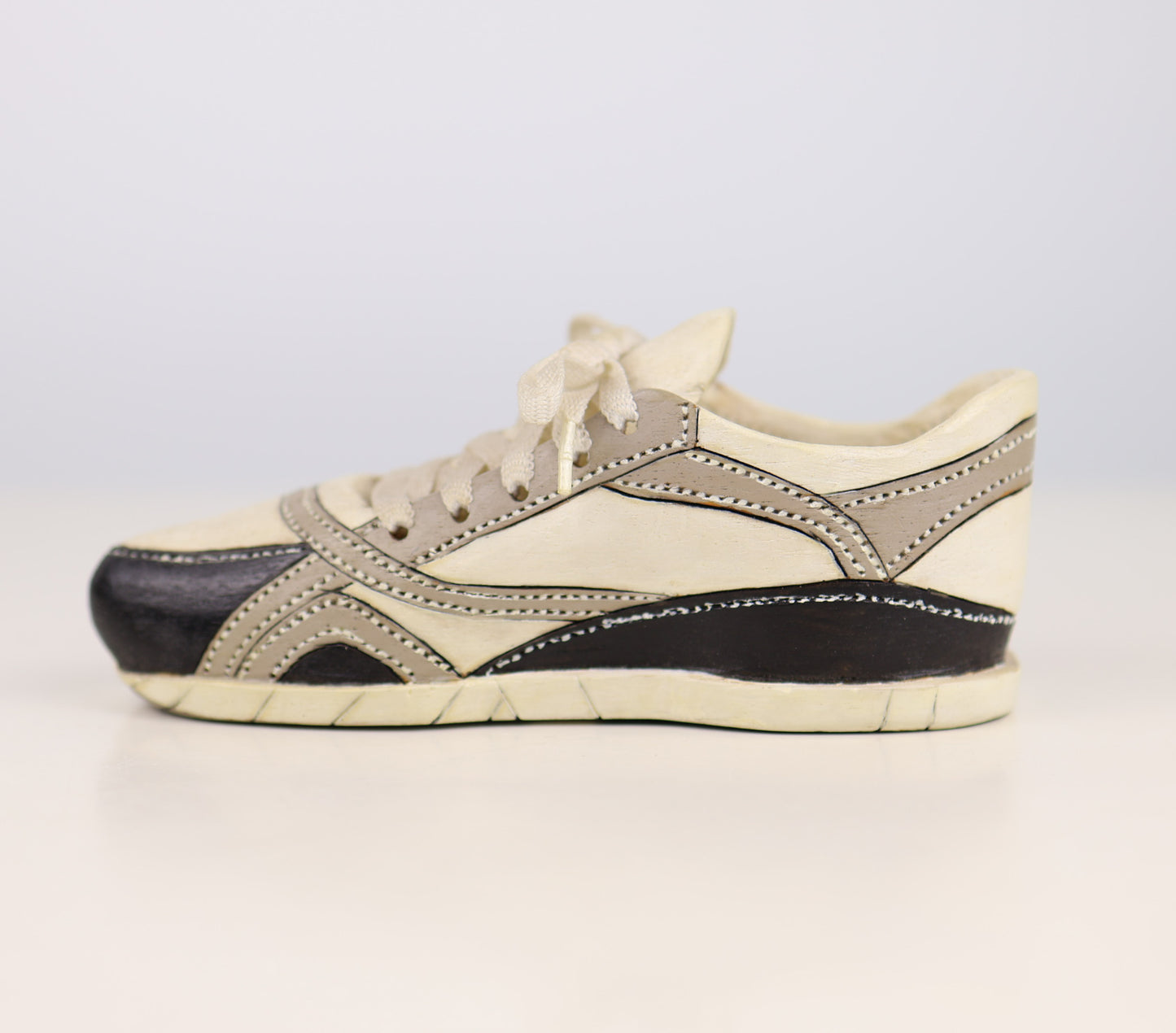 Vintage outsider art hand carved shoe art sculpture white with black and grey stripes