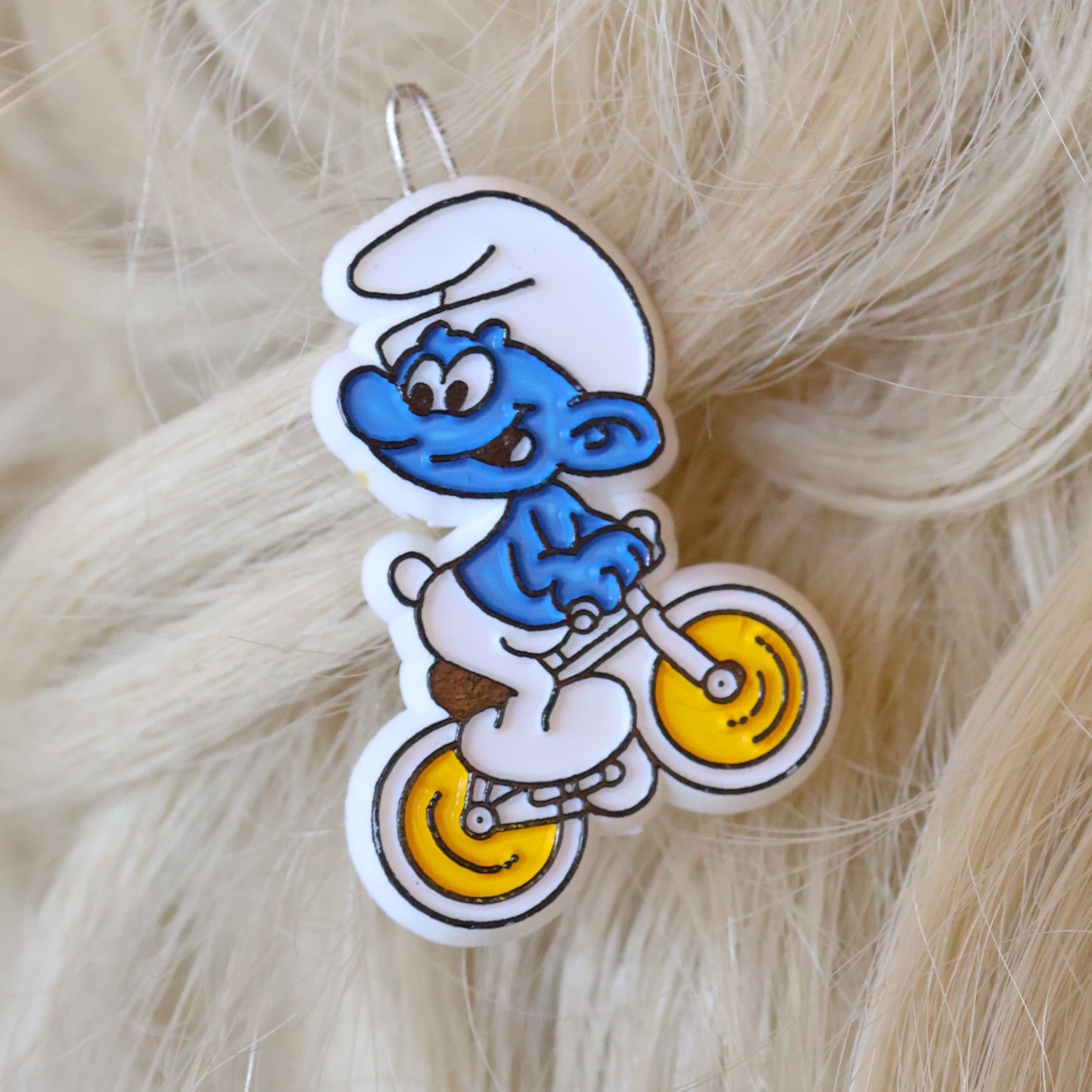 Vintage Peyo Smurf riding bike cycling embossed and painted plastic hair beret 